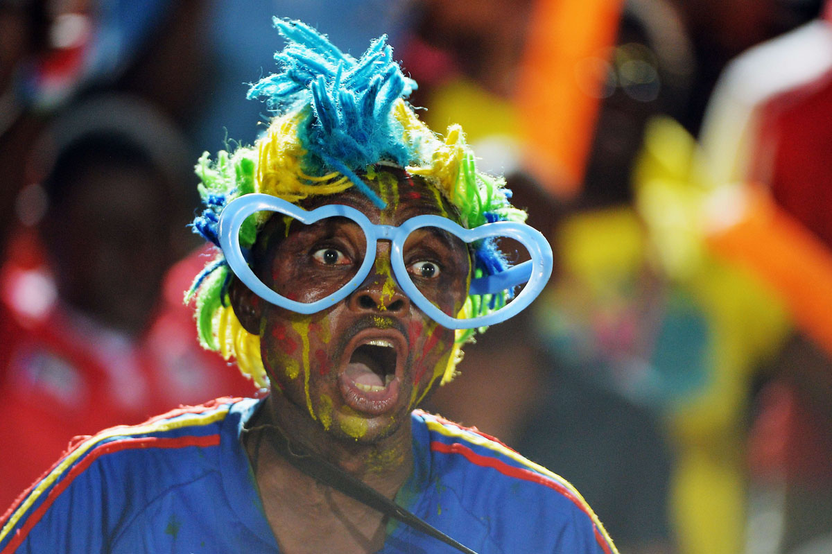 TOPSHOTS A Democratic Republic of the Congo fan cheers for his team during the 2015 African Cup of Nations group B football match between Cape Verde and Democratic Republic of the Congo in Ebebiyin on January 22, 2015. AFP PHOTO / KHALED DESOUKIKHALED DESOUKI/AFP/Getty Images ORG XMIT: 528433287